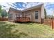 Back exterior of house with deck and fenced yard at 11211 Winget Pond Rd, Charlotte, NC 28278