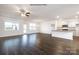 Open living room with kitchen island and hardwood floors at 1417 6Th Ne St, Hickory, NC 28601