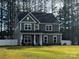 Two-story craftsman style home with a gray exterior and white trim at 328 Shinnville Rd, Mooresville, NC 28115