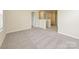 Upstairs bedroom with gray carpeting, neutral walls, and a window at 506 Olympia Way, York, SC 29745