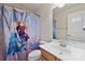 Clean bathroom with a white vanity and Frozen-themed shower curtain at 1814 Mill Creek Ln, Concord, NC 28025