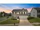 Two-story house with a two-car garage and landscaping at 1814 Mill Creek Ln, Concord, NC 28025