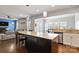 Kitchen features granite countertops, stainless steel appliances, and an open layout to Gathering room at 1814 Mill Creek Ln, Concord, NC 28025