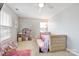Charming bedroom with a daybed, dollhouse, and plenty of natural light at 1814 Mill Creek Ln, Concord, NC 28025