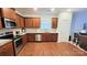 Modern kitchen with stainless steel appliances and wood cabinets at 343 Ox Bow Cir, Mount Holly, NC 28120
