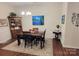 Dining room with wooden table and chairs, and decorative artwork at 343 Ox Bow Cir, Mount Holly, NC 28120