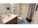 Simple bathroom with a bathtub, shower, and updated vanity at 343 Ox Bow Cir, Mount Holly, NC 28120