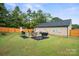 Fenced backyard with patio, grill, and plenty of green space at 1723 Johnson St, Albemarle, NC 28001