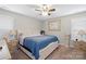 Bright bedroom featuring a king-size bed and ceiling fan at 1723 Johnson St, Albemarle, NC 28001