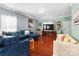 Spacious living room with hardwood floors, comfortable sectional sofa, and large TV at 5051 Meanna Dr, Clover, SC 29710