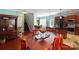 Bright dining area with hardwood floors, and a view into the kitchen at 5051 Meanna Dr, Clover, SC 29710