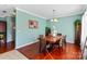 Bright dining room features hardwood floors and a wood dining table at 5051 Meanna Dr, Clover, SC 29710
