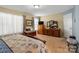 Large bedroom with a dresser, window, and comfortable seating area at 5051 Meanna Dr, Clover, SC 29710