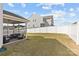 Screened porch with seating overlooks fenced backyard at 1097 Sw River Haven Ave, Concord, NC 28025