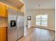 Kitchen with stainless steel refrigerator and wood cabinets at 1205 Danielle Downs Ct, Concord, NC 28025
