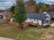 Aerial view of a ranch home with a deck and shed at 1205 Danielle Downs Ct, Concord, NC 28025