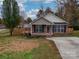House exterior showcasing a deck and fenced yard at 1205 Danielle Downs Ct, Concord, NC 28025