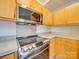Close-up of kitchen stove and microwave at 1205 Danielle Downs Ct, Concord, NC 28025