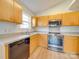 Kitchen with stainless steel appliances and wood cabinets at 1205 Danielle Downs Ct, Concord, NC 28025