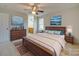 Main bedroom with dresser, large bed, and ensuite bathroom at 1205 Danielle Downs Ct, Concord, NC 28025