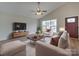 Living Room with large window, hardwood floors, and comfortable seating area at 1205 Danielle Downs Ct, Concord, NC 28025
