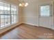 Dining area with hardwood floors and a large window at 1205 Danielle Downs Ct, Concord, NC 28025