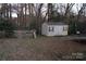 Backyard with storage shed, fenced area, and trampoline at 2020 Parkdale Ave, Gastonia, NC 28052