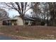 House with mature trees and a fire hydrant nearby at 2020 Parkdale Ave, Gastonia, NC 28052