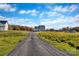 Gravel driveway leading to a house in a new development at 4126 Old Monroe Marshville Rd, Wingate, NC 28174