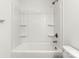 Clean bathroom with a shower/tub combo and shelving at 4126 Old Monroe Marshville Rd, Wingate, NC 28174