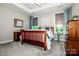 Well-lit bedroom featuring a wooden bed frame and ample closet space at 8221 Festival Way, Charlotte, NC 28215