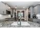 Modern kitchen with gray cabinets, granite countertops, and island at 8221 Festival Way, Charlotte, NC 28215