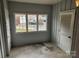 Entryway with tile floor, multiple windows, and a louvered door at 910 Mcalway Rd # C, Charlotte, NC 28211