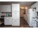 Kitchen with white cabinets, granite counters and laundry access at 394 Link Dr, Iron Station, NC 28080