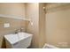 Laundry room with utility sink and ample storage shelving at 106 Hunter Ct, Kings Mountain, NC 28086