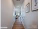 Light-filled hallway with hardwood floors and access to living areas at 2741 Winn Mill Dr # 50, Gastonia, NC 28056