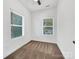 Bright bedroom with neutral carpeting and two large windows at 103 Pleasant Hill St, Lancaster, SC 29720