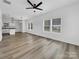 Open living room with hardwood floors and views into the kitchen at 103 Pleasant Hill St, Lancaster, SC 29720