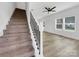 Staircase with carpet runner and metal balusters leading to the second floor at 103 Pleasant Hill St, Lancaster, SC 29720
