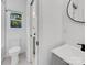 Clean bathroom with a white vanity, toilet and shower/tub combo at 103 Pleasant Hill St, Lancaster, SC 29720