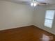 Bright bedroom featuring hardwood floors and ceiling fan at 139 Sain Rd, Statesville, NC 28625