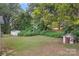 Large backyard with shed and small dog house at 900 Alma Ave, Kannapolis, NC 28081