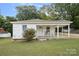 Charming one-story home with covered porch and well-maintained lawn at 900 Alma Ave, Kannapolis, NC 28081