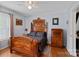 Bedroom with antique wooden bed and dresser at 900 Alma Ave, Kannapolis, NC 28081