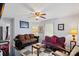 Living room featuring two sofas, checkerboard floor, and antique furniture at 900 Alma Ave, Kannapolis, NC 28081