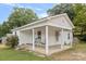 White bungalow with covered porch, offering curb appeal at 900 Alma Ave, Kannapolis, NC 28081