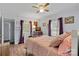 Bedroom with double bed, dresser, and ceiling fan at 900 Alma Ave, Kannapolis, NC 28081
