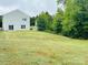 Large backyard with a treeline at 229 Lake George Dr, Shelby, NC 28152