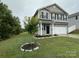 Two-story house with gray siding and a two-car garage at 229 Lake George Dr, Shelby, NC 28152