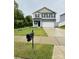 Two-story house with gray siding and a two-car garage at 229 Lake George Dr, Shelby, NC 28152